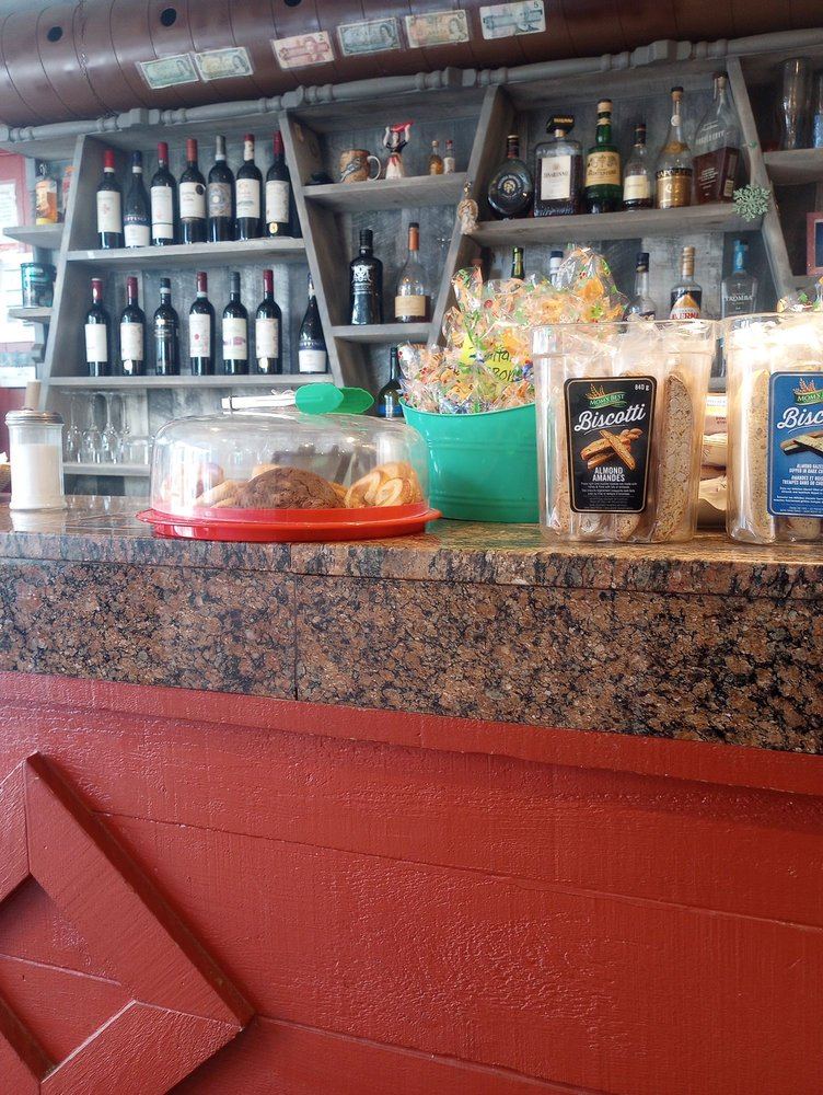 The bar counter with Italian bottles on the shelves