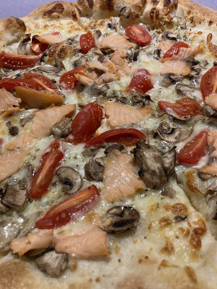 Salmon, roasted tomato and mushroom pizza